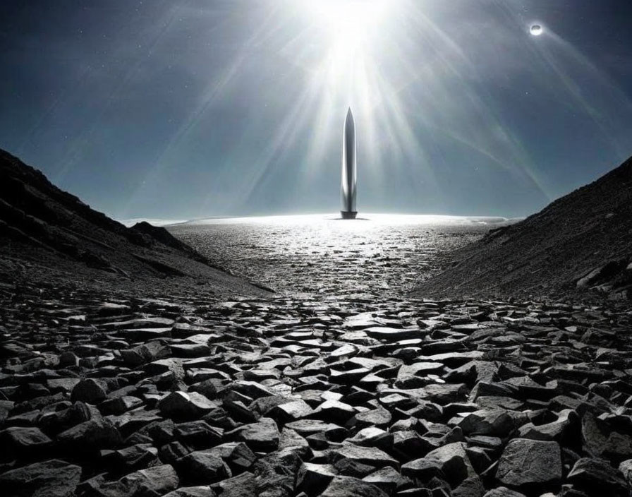 Monolithic tower in barren landscape under starry sky