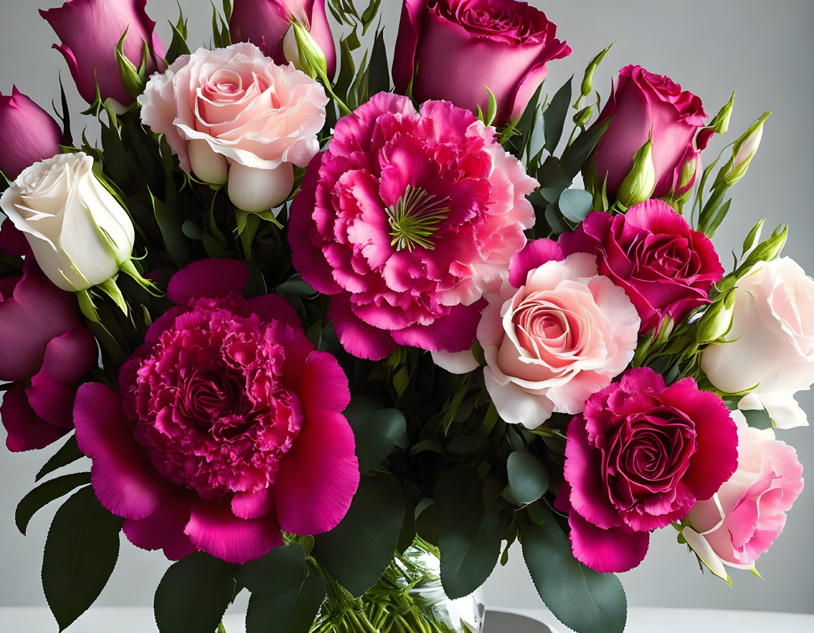 Pink and White Roses with Deep Pink Carnations in Clear Vase