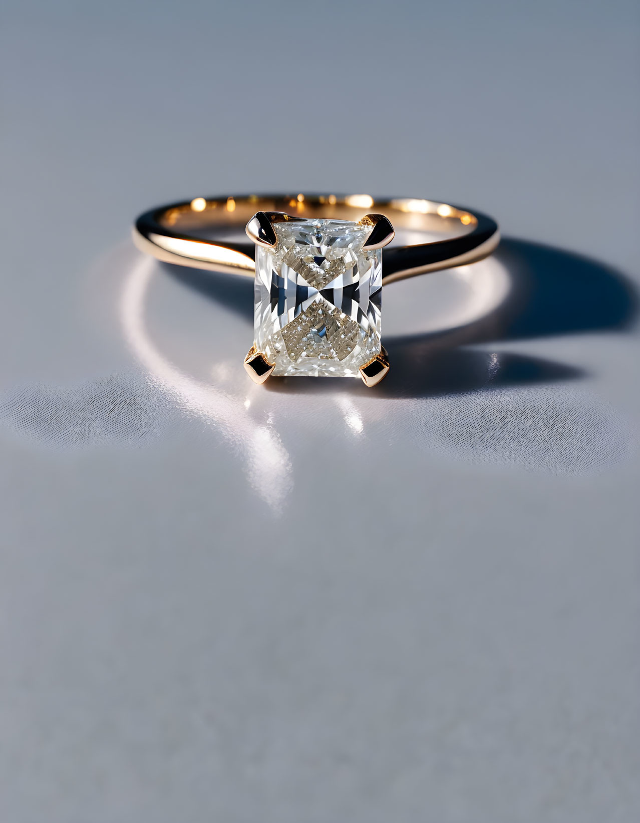 Radiant Cut Diamond Ring on Gold Band with Reflection