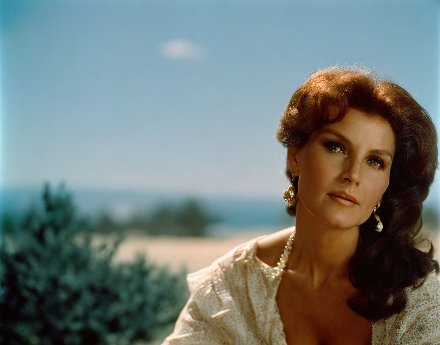 Voluminous hair woman in white blouse outdoors