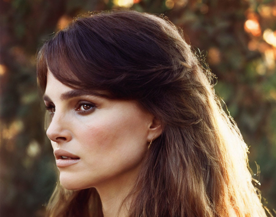 Portrait of woman with dark hair and fair skin in tranquil setting