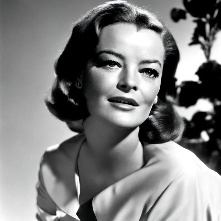 Classic Black and White Portrait of Woman with Wavy Hair and Soft Gaze