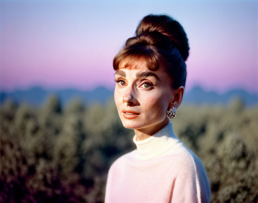 Elegant woman in pink turtleneck with ornate earrings against dusk sky