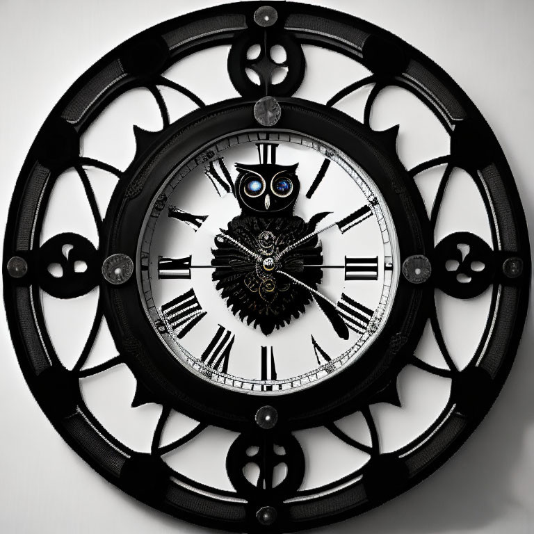 Black Wall Clock with Roman Numerals and Owl Figure with Blue Eyes