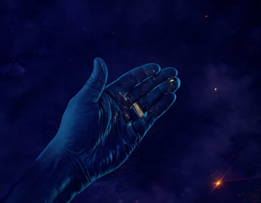 Blue hand against starry night sky with glowing fingertips