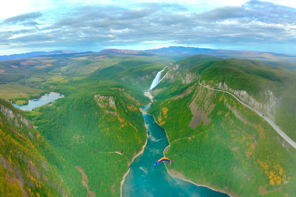 Scenic panorama of lush valley with river, paraglider, and waterfall