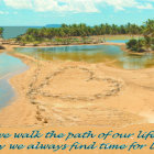 Tropical beach scene with palm trees, river, and love quote