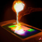 Flaming smartphone with colorful screen and rising smoke