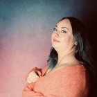 Surreal portrait of woman with sky-themed complexion