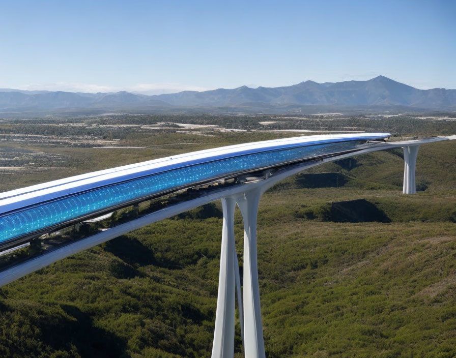 Futuristic elevated train in lush landscape with mountains under blue sky