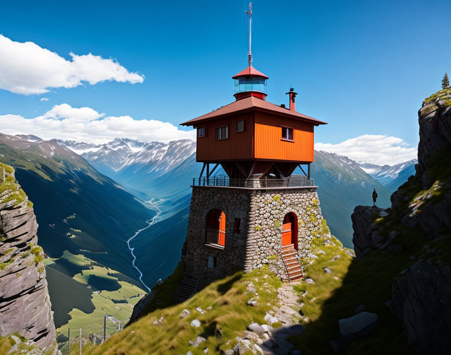 Red Lookout Tower on Rocky Mountain Peak with Valley and Snow-Capped Mountains