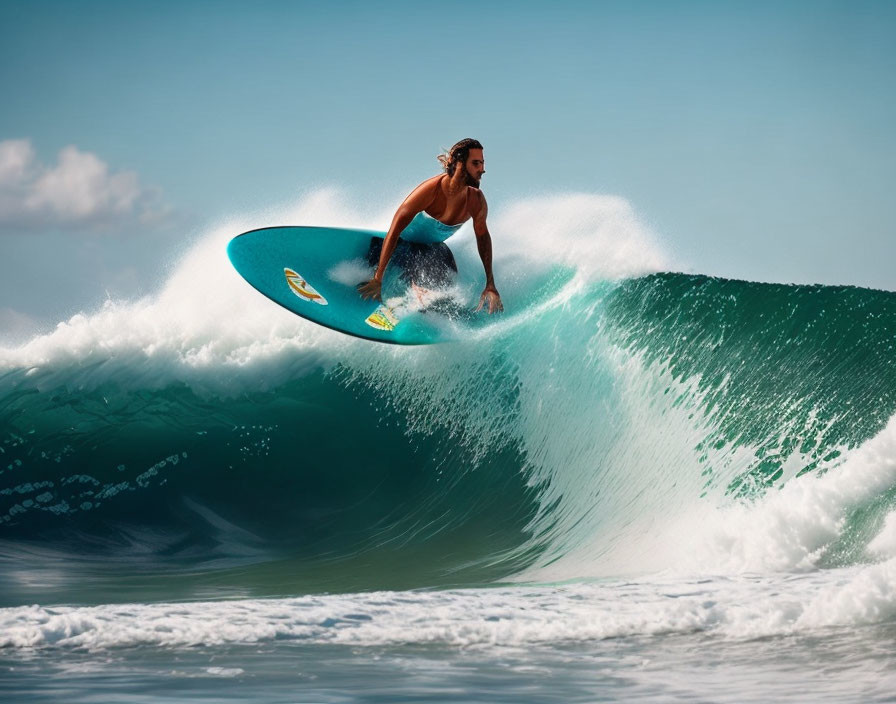 Long-haired surfer riding turquoise wave on blue surfboard