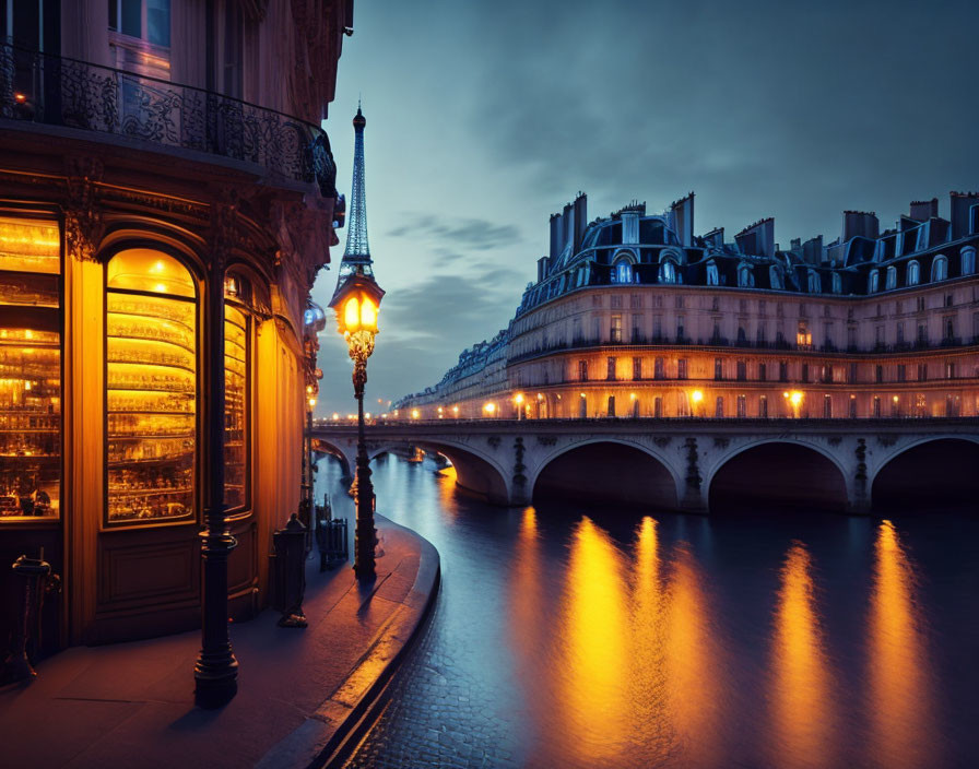 Riverfront Twilight Scene with Illuminated Buildings and Street Lamps