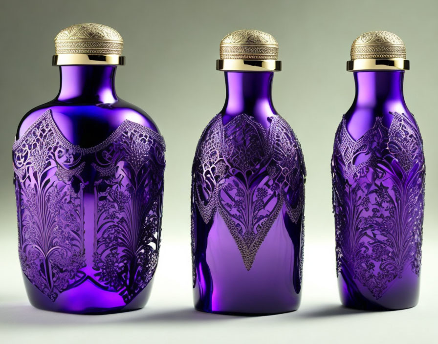 Ornate Purple Glass Bottles with Gold Caps and Floral Etchings