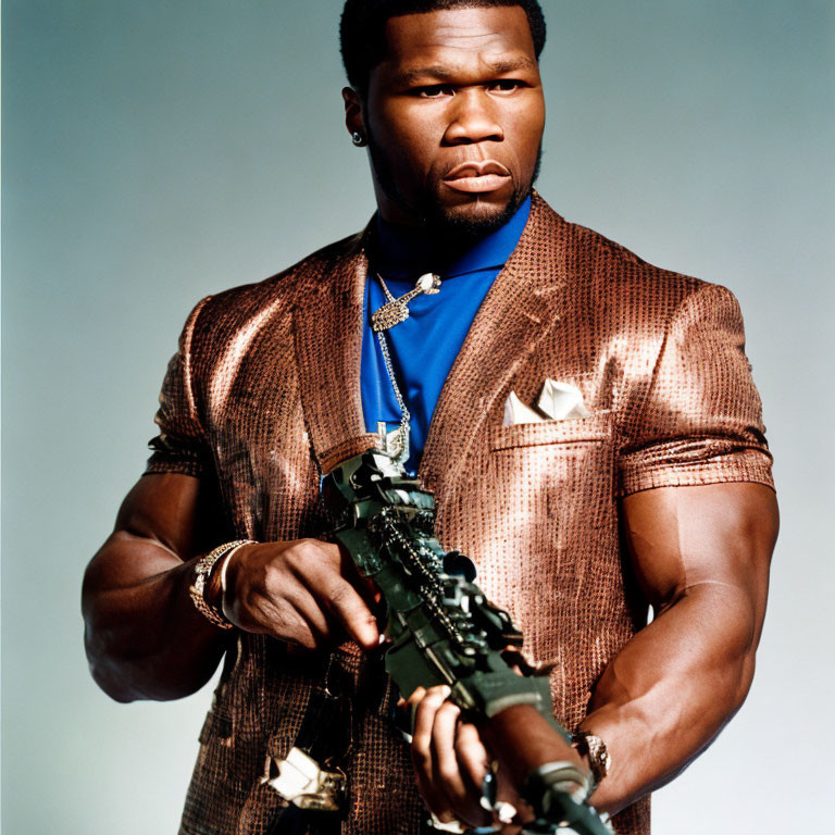 Serious man in shiny brown suit holding rifle