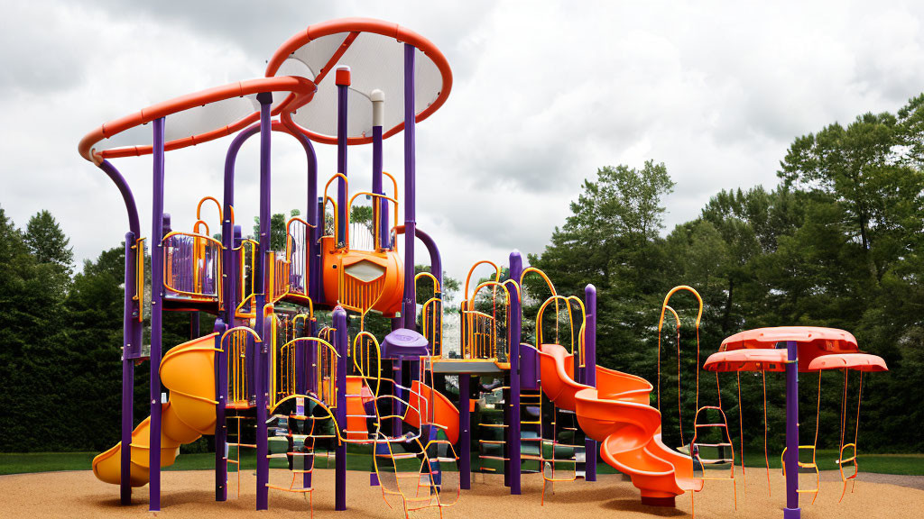 Vibrant playground with slides, climbing structures, and ladders under cloudy skies