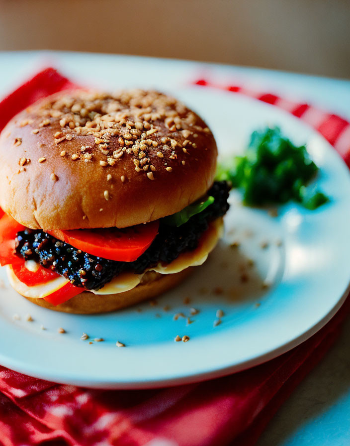 Sesame Seed Bun Hamburger with Lettuce and Tomatoes on White Plate