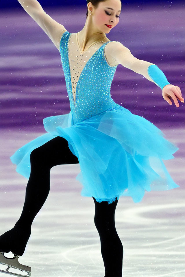 Female Figure Skater Performs Gracefully in Blue Costume