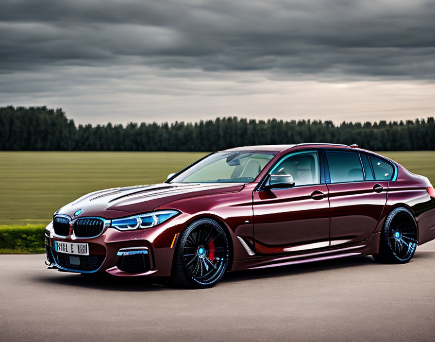 Maroon BMW M3 with Black Rims on Asphalt Road