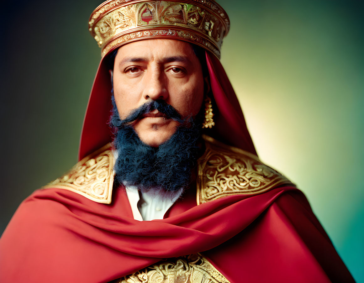 Regal man in ornate attire with golden crown and red cape poses solemnly