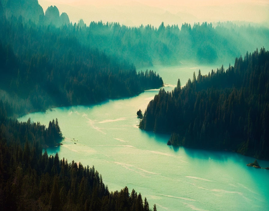 Tranquil landscape: Turquoise lake, misty forests, undulating hills