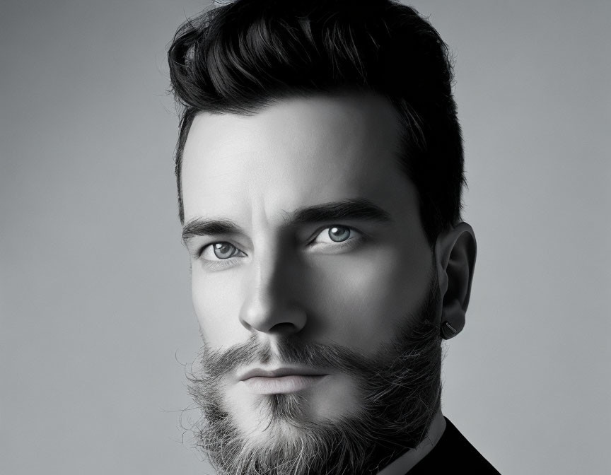 Stylish monochrome portrait of man with beard and intense gaze