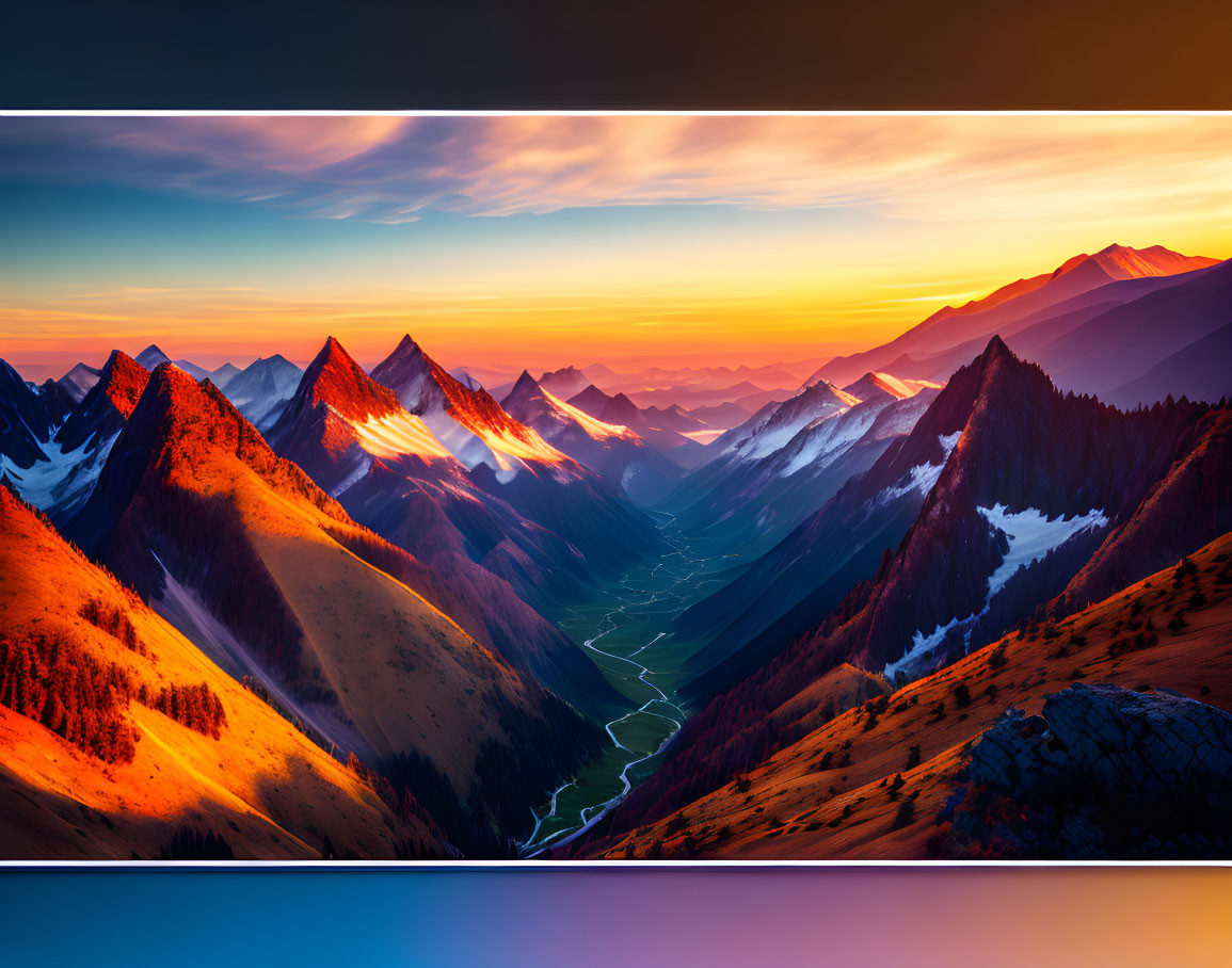 Snow-capped mountain range at sunset with vibrant skies and winding river