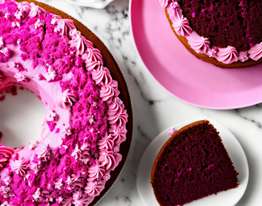 Pink Frosted Cake with Red Interior on Floral Plate