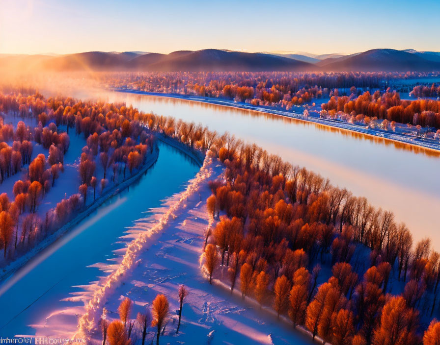 Aerial View of Winding River in Snowy Landscape