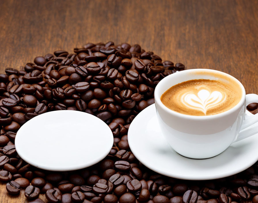 Cappuccino with Heart Latte Art and Coffee Beans on Wooden Surface