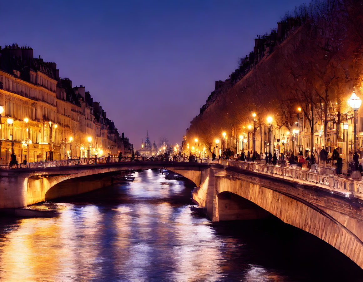 Serene river at twilight with illuminated streets, classic architecture, bridge, and city lights reflecting on water