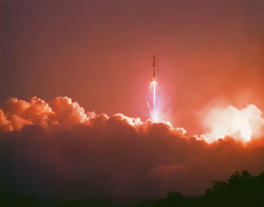 Rocket soaring through dramatic sunset sky.