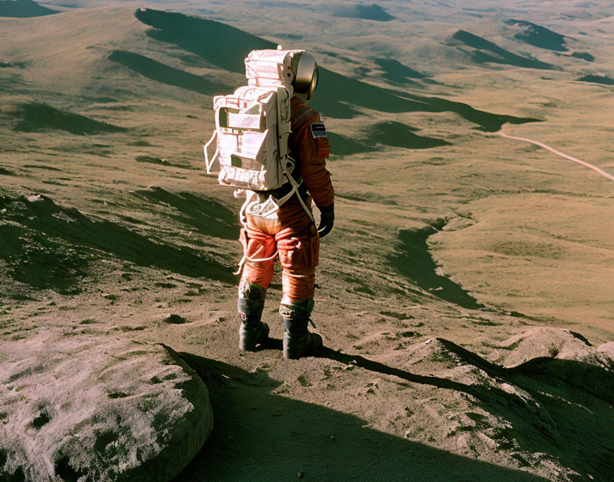 Astronaut in space suit exploring rocky alien planet landscape