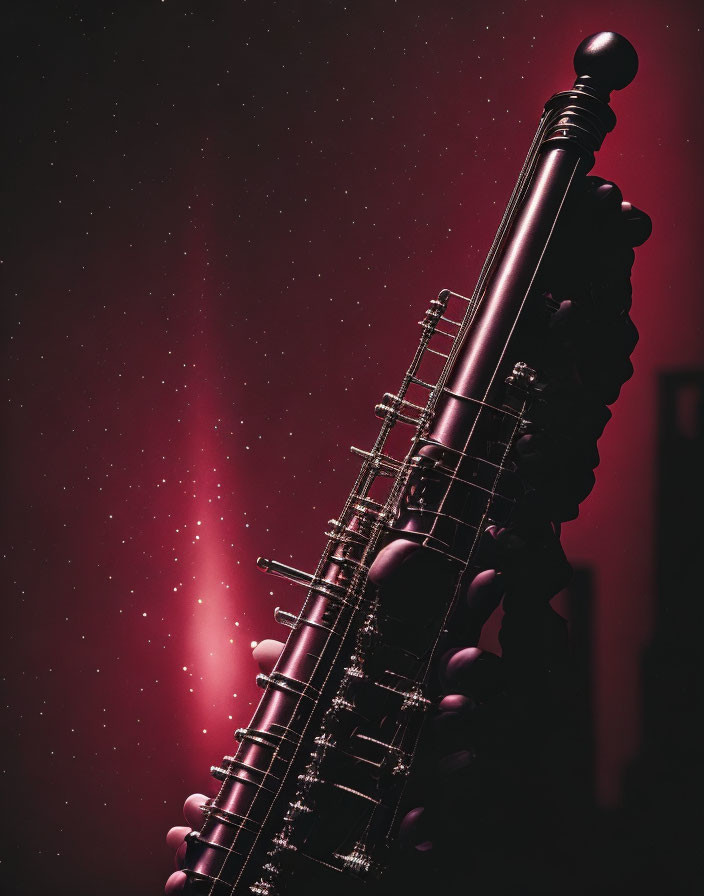 Close-up vertical saxophone against pink and purple starry background