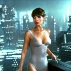 Futuristic woman in silver suit against cityscape backdrop