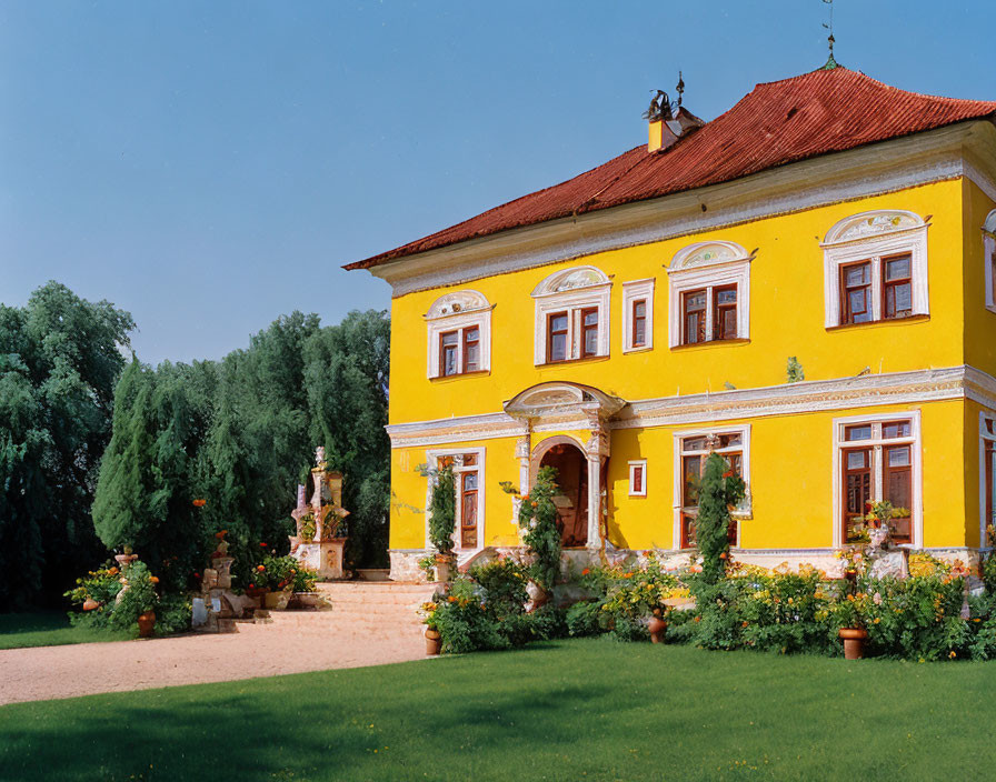 Yellow Two-Story House with Red Roof Tiles and White Windows