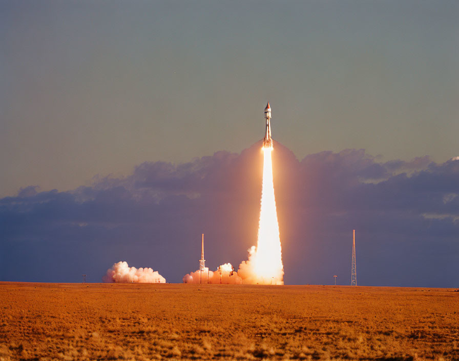 Rocket Launching with Fiery Blast on Clear Day