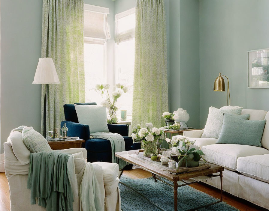 Pale Blue Living Room with White Furniture and Green Accents