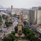 Colorful Urban Area with Dense Buildings and Greenery Under Hazy Sky