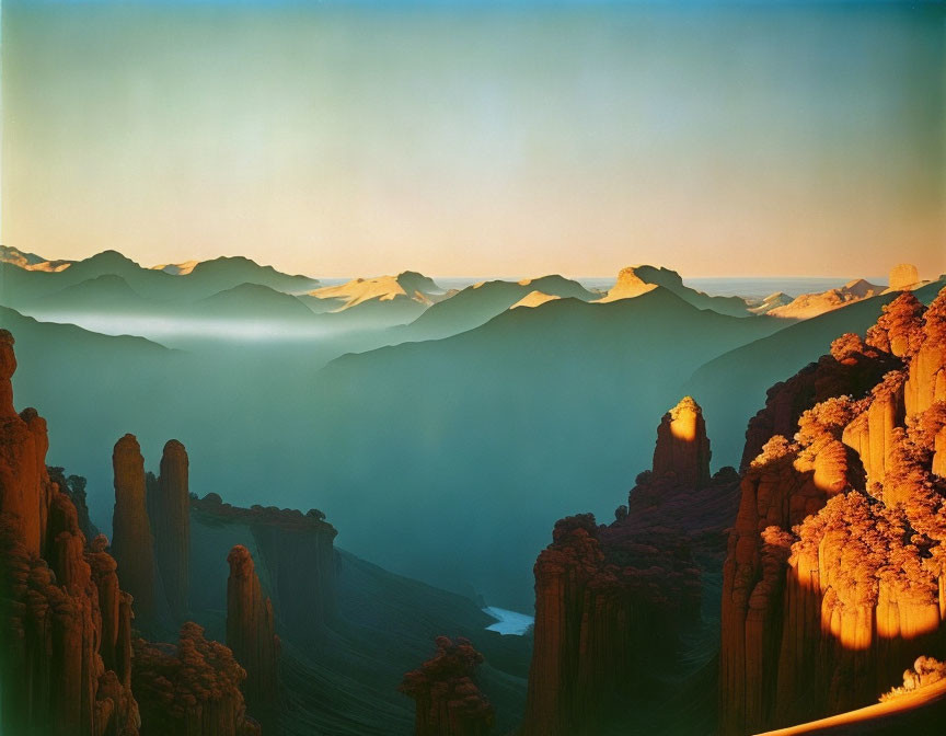 Mist-Shrouded Mountain Peaks and Cliffs at Sunrise