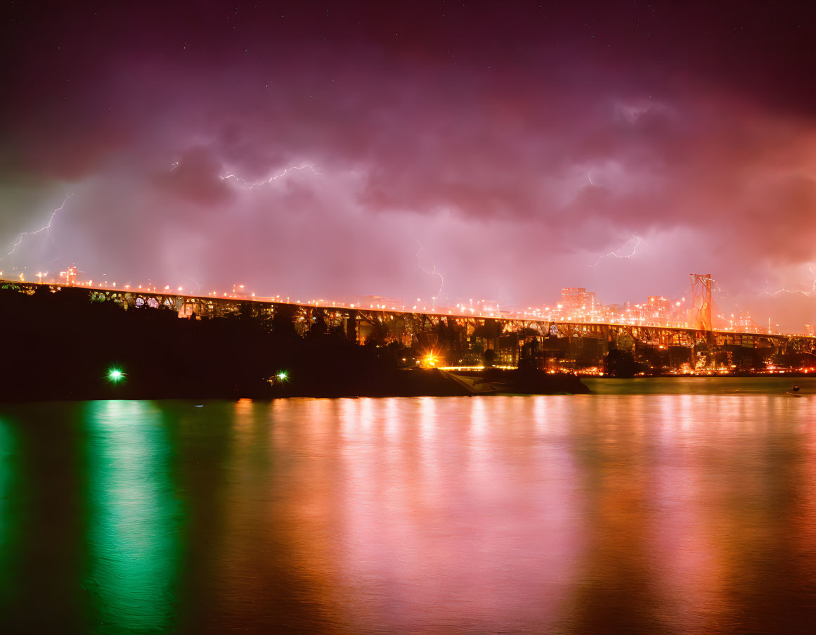 Nighttime bridge over reflective water under stormy purple sky with lightning