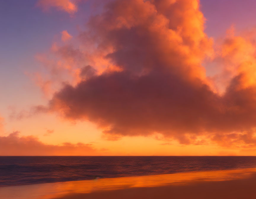 Vibrant ocean sunset with orange and purple hues and large fiery clouds