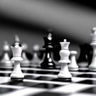 Black and White Chess Set Mid-Game with Black Pawn Focus