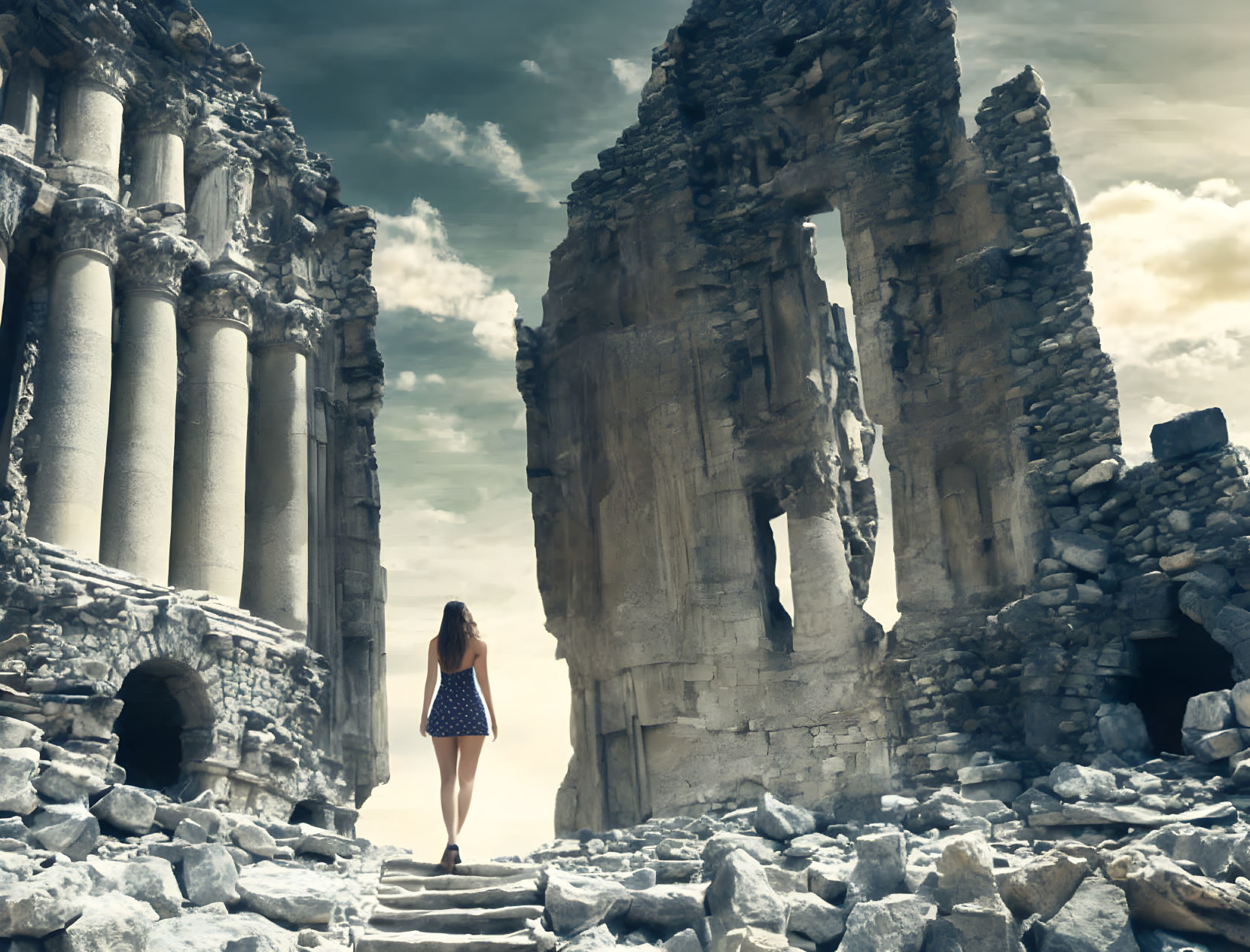 Woman explores ancient ruins under dramatic sky