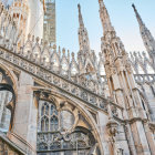 Elaborate Gothic architecture with stone spires and stained glass windows