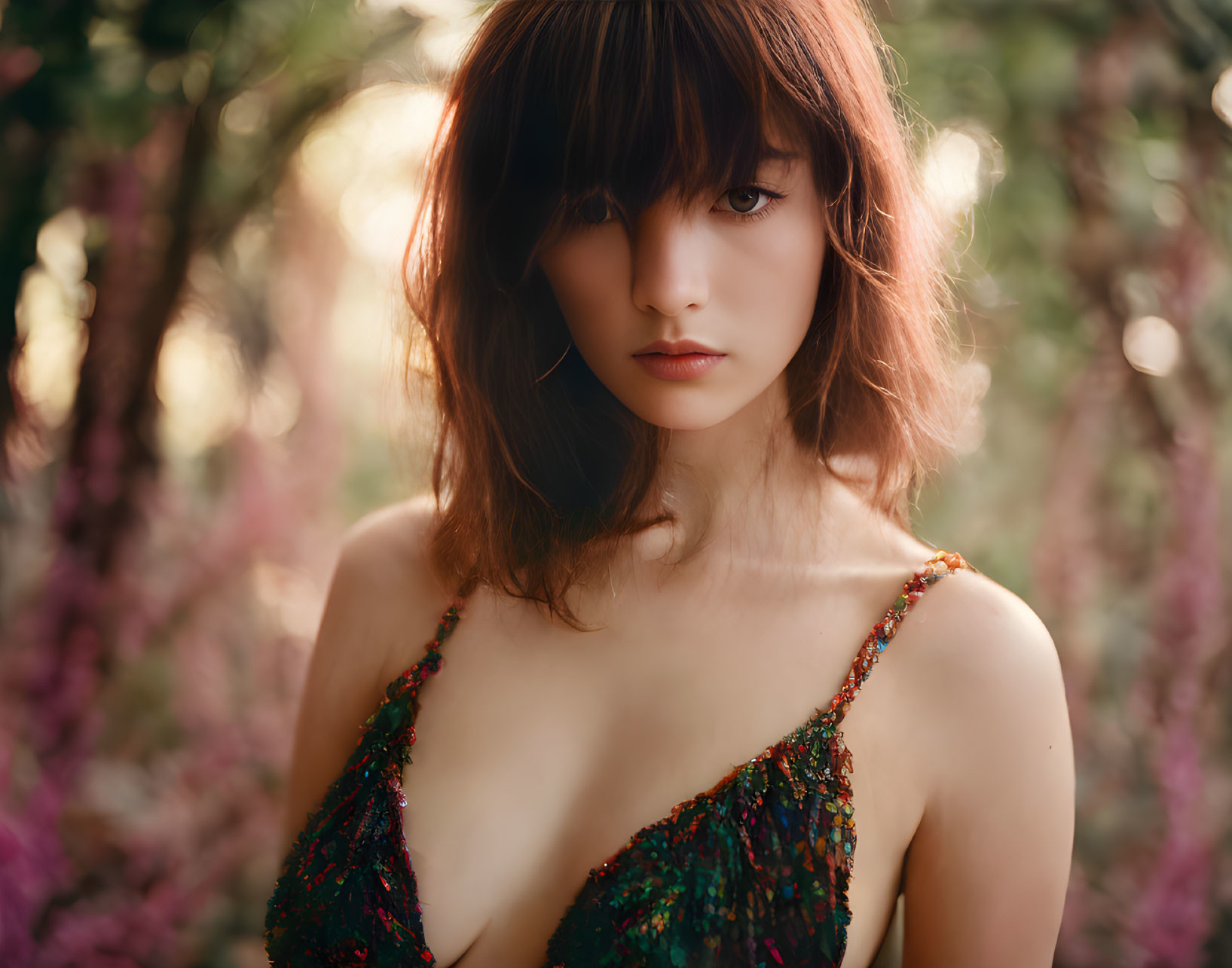 Woman with Bangs in Sequined Dress Surrounded by Pink Blossoms