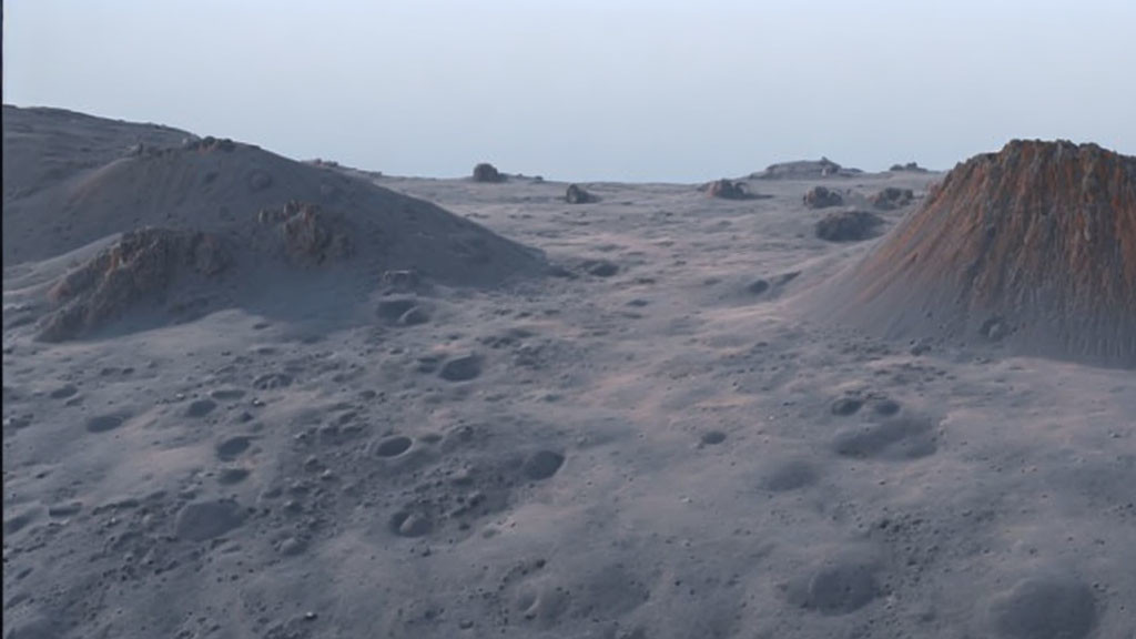 Barren moonscape with grey soil and scattered craters.