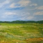 Tranquil landscape: green meadows, blue sky, fluffy clouds, distant forest