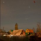 Peaceful Village Night Scene by Calm Lake