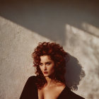 Woman with Voluminous Hair in Sunlight Casting Shadows